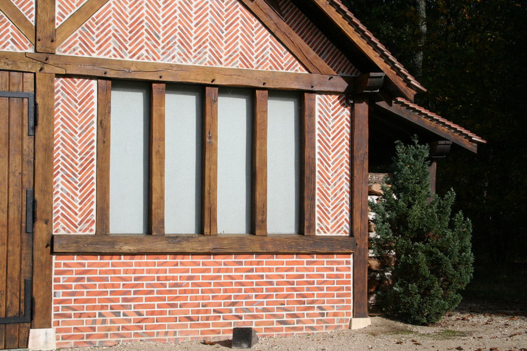 Grange avec colombage vitré et remplissage briquettes